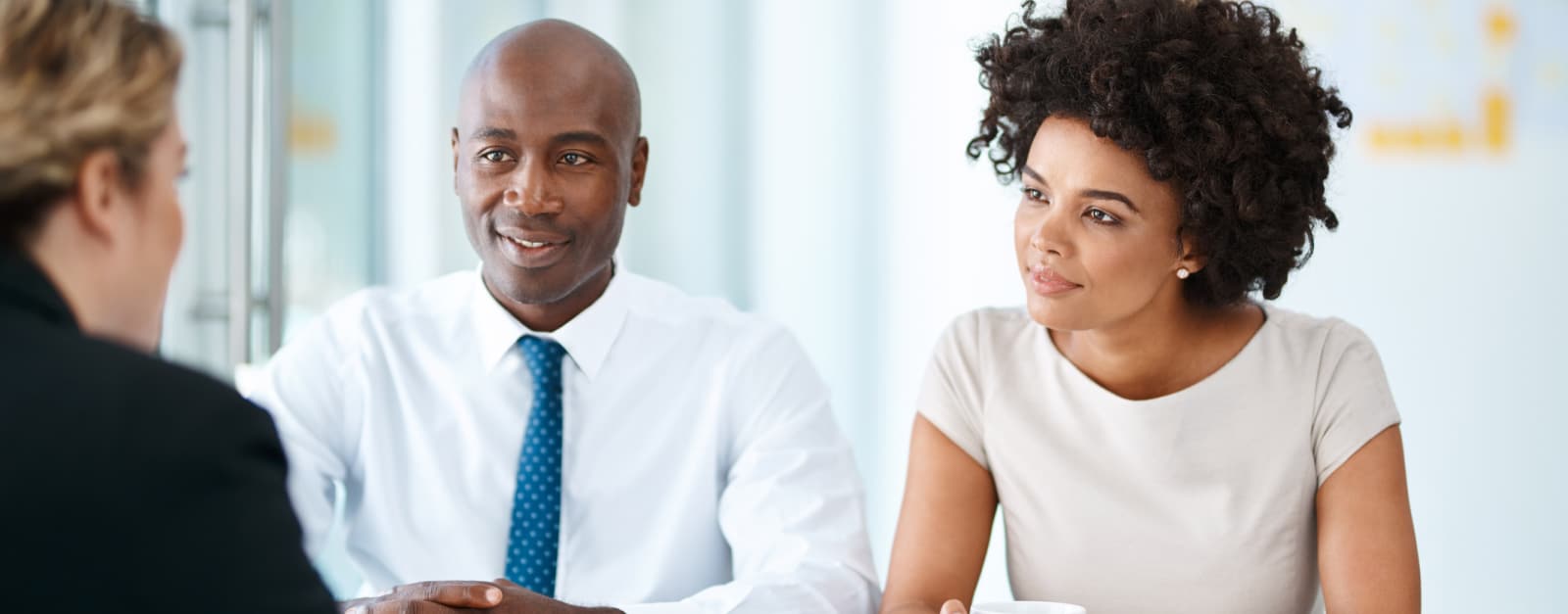 Two job candidates meeting with a human resources advisor
