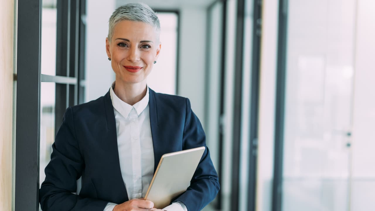 Woman in business suit smiling at camera