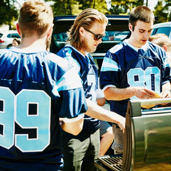 Charlotte Panther football fans grill outside the stadium