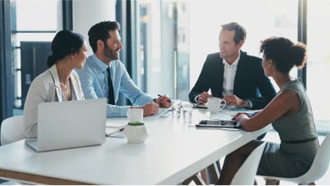 Finance team discussing at a conference table