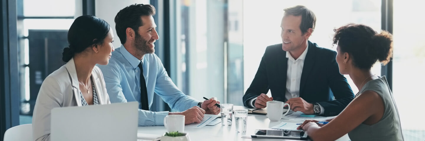 Finance team discussing at a conference table