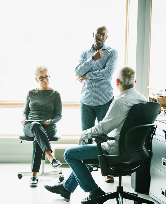 Three people having a meeting