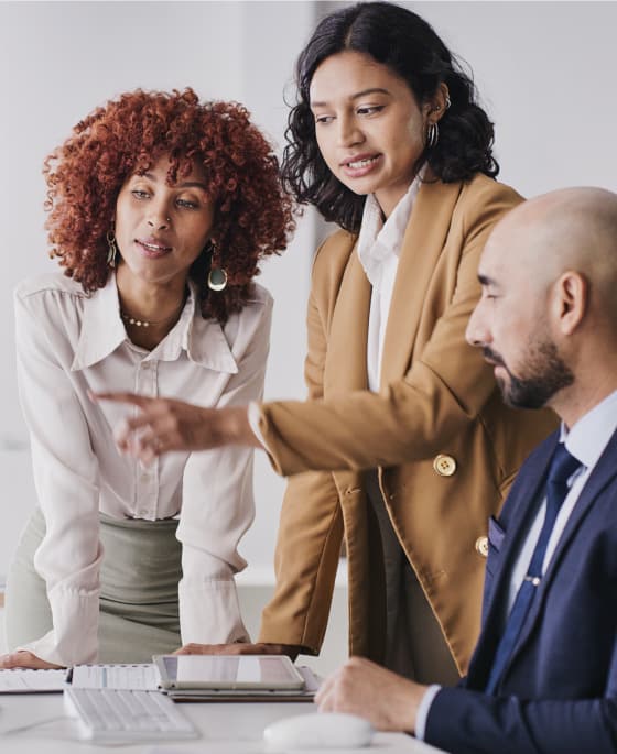 Three people working in a meeting