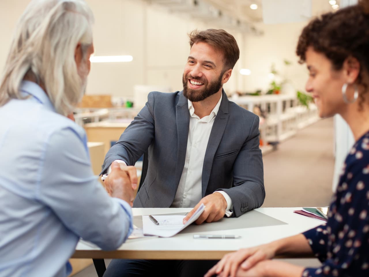 Man shaking hands with a woman