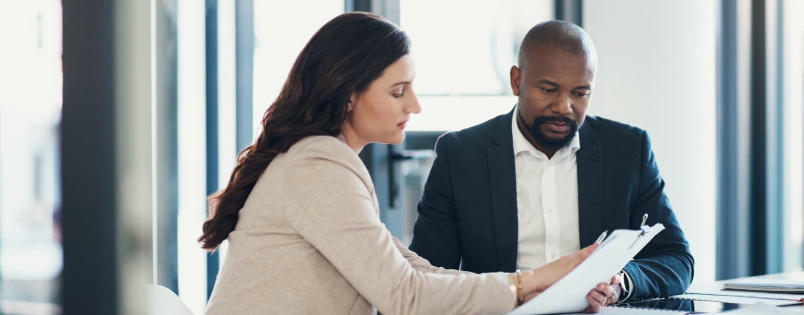 Man and woman reviewing paperwork
