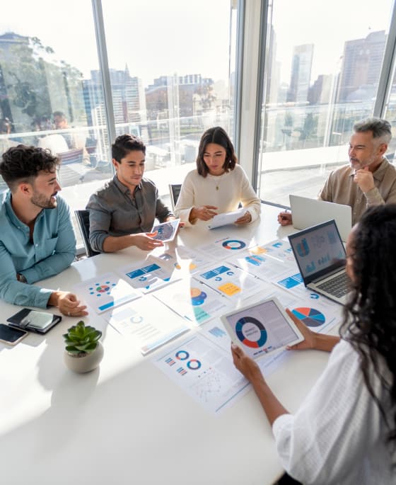 Group of people sitting around conference table